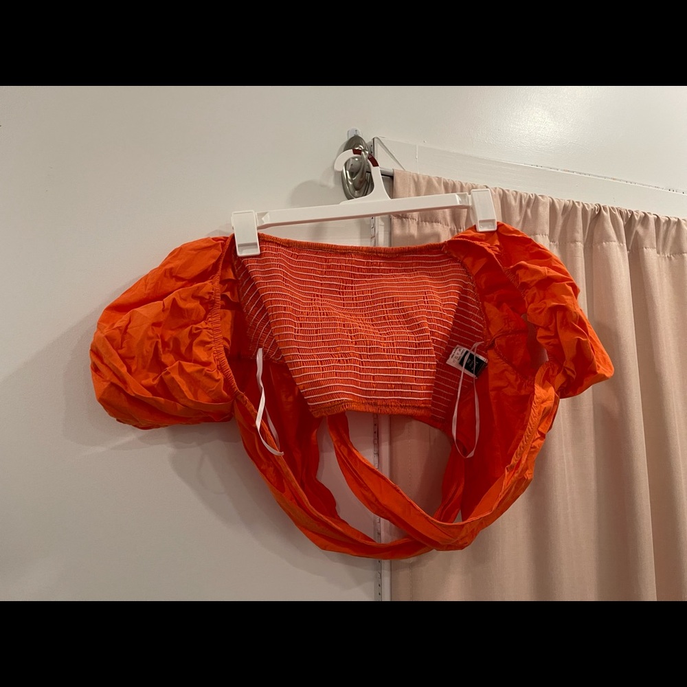 orange never worn cross tube top